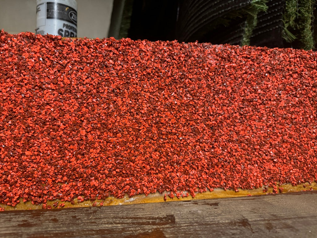 How do I trowel EPDM granules on a vertical surface?