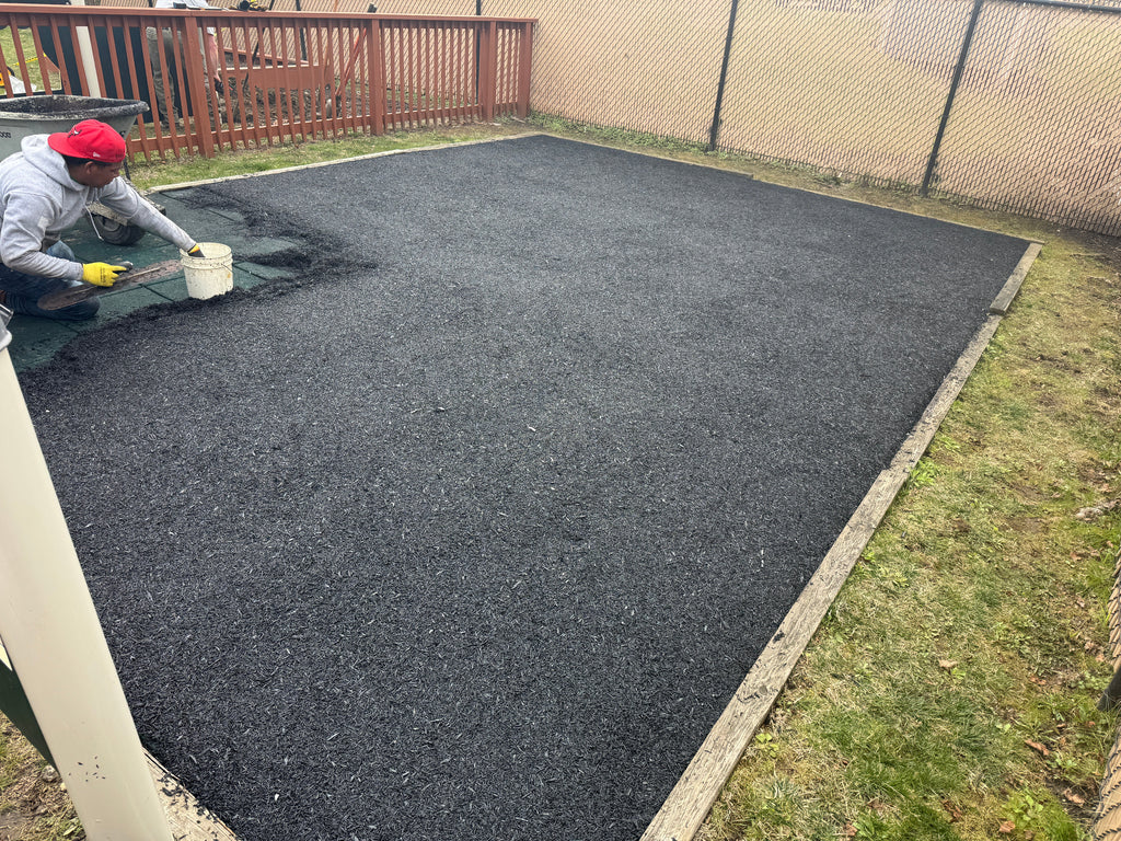installing poured in place rubber on top of playground rubber tiles
