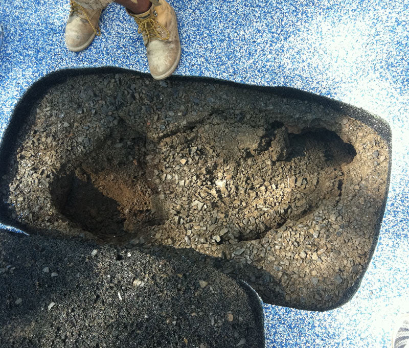 There is a sink hole under my playground rubber surface